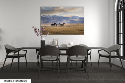 a dining room table with chairs and a painting on the wall