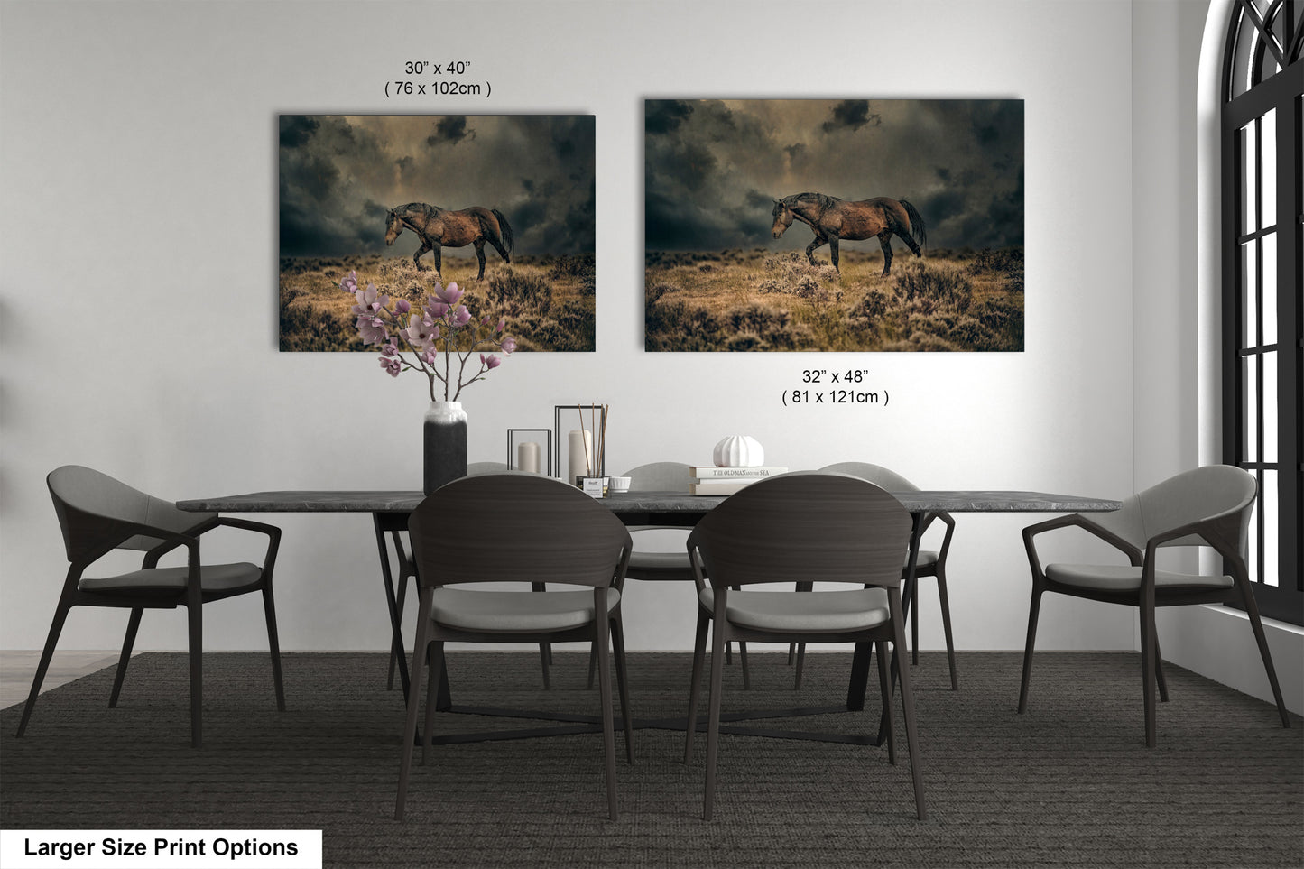 a dining room table with four chairs and two pictures of a horse on the wall