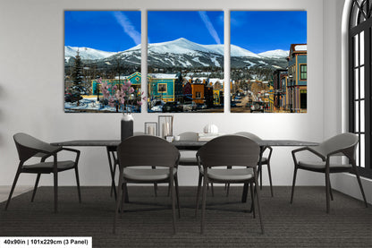 a dining room with a table and four chairs