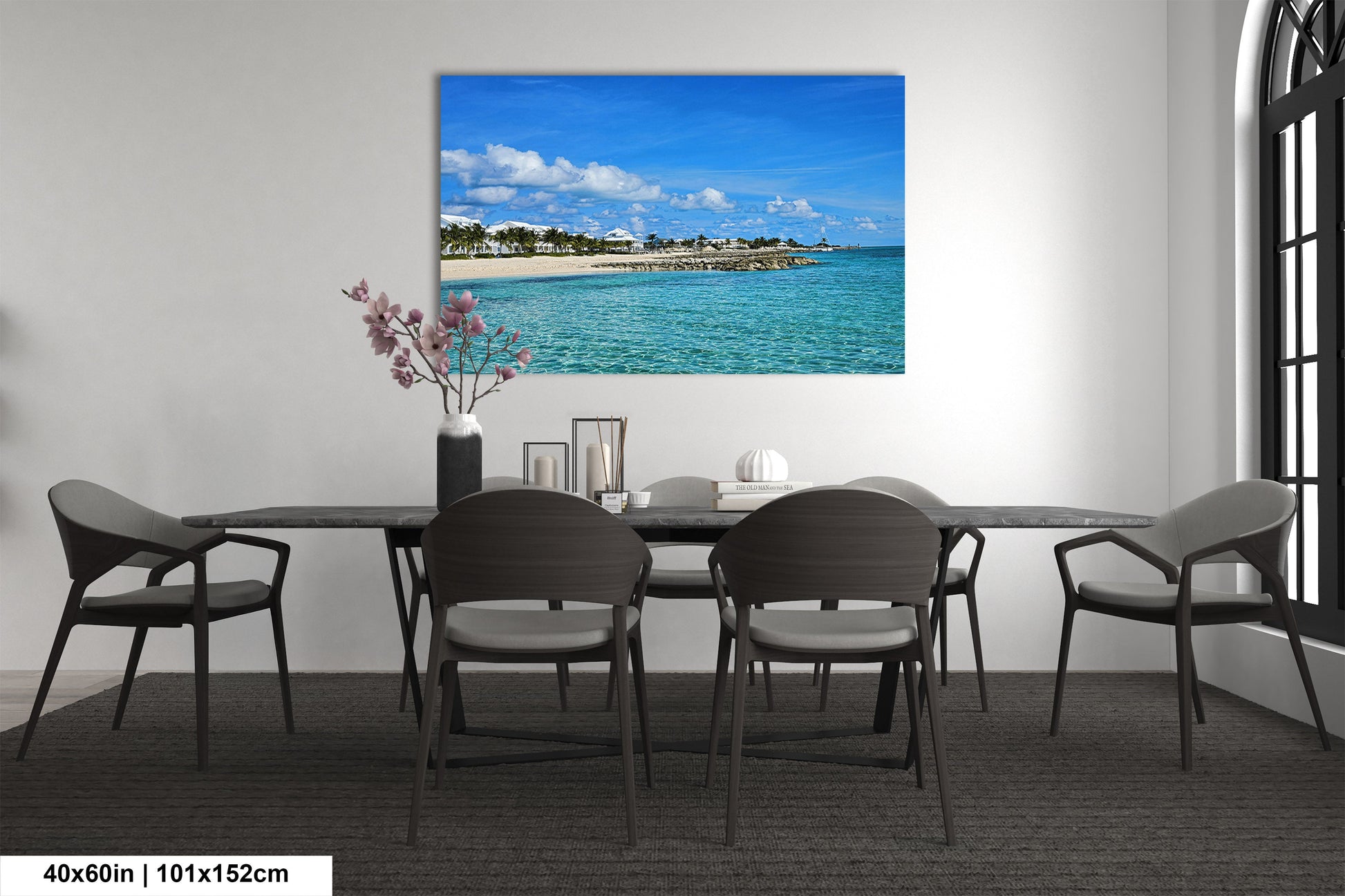 a room with a table and chairs and a painting on the wall
