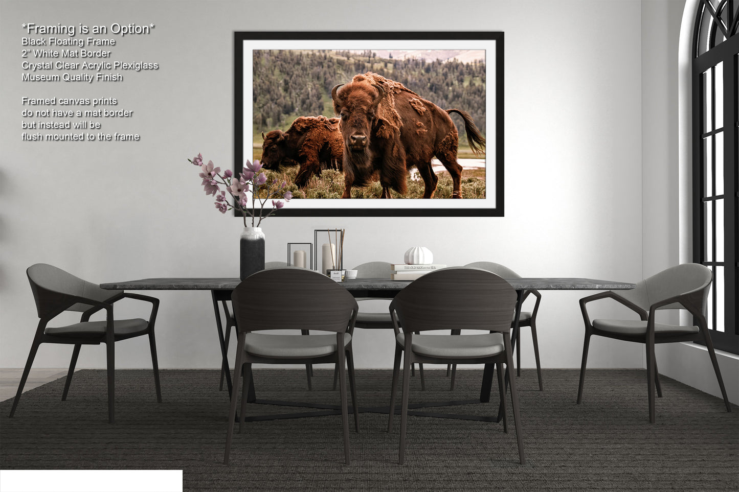 a dining room table with chairs and a picture of a bison on the wall