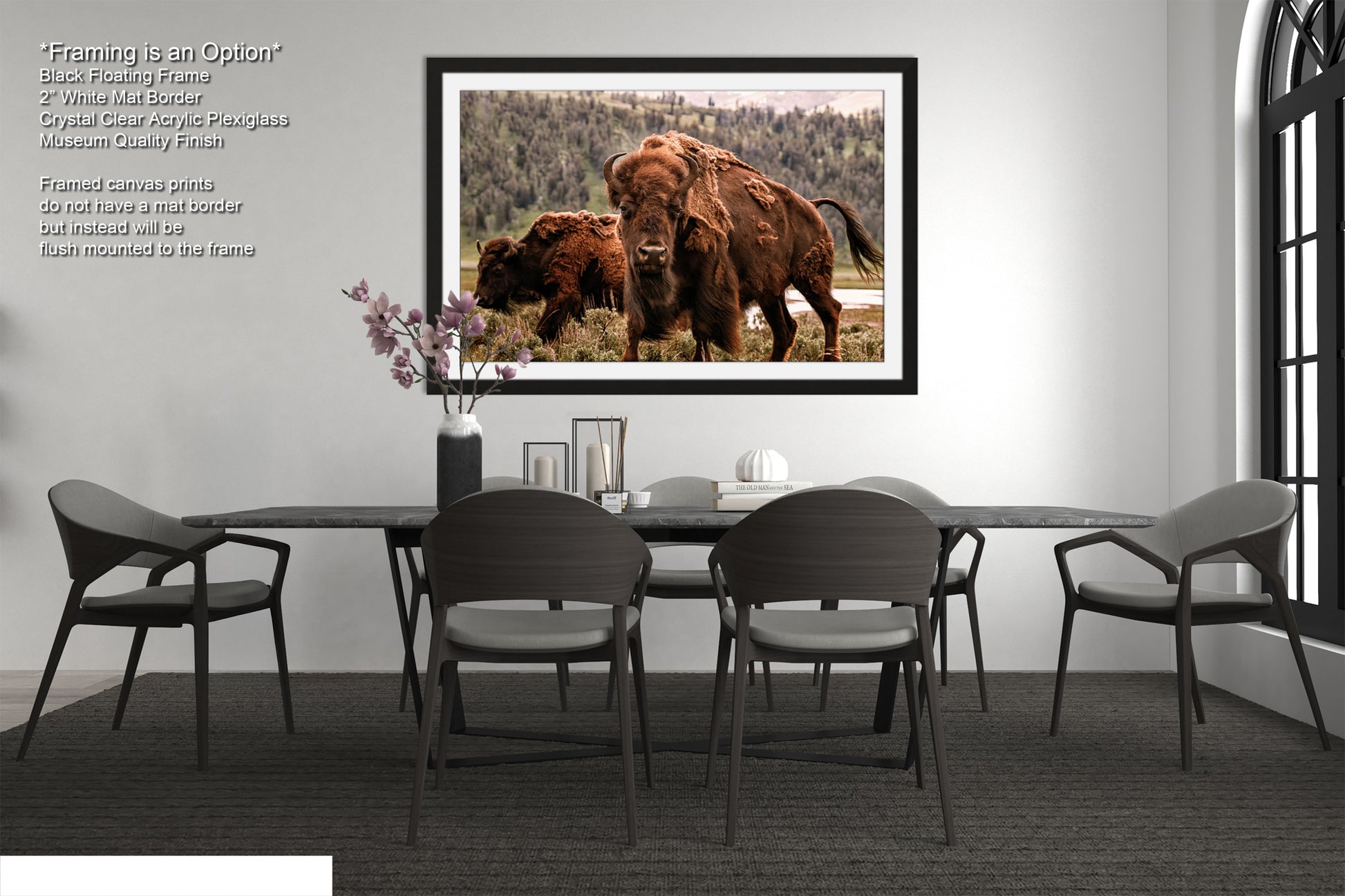 a dining room table with chairs and a picture of a bison on the wall