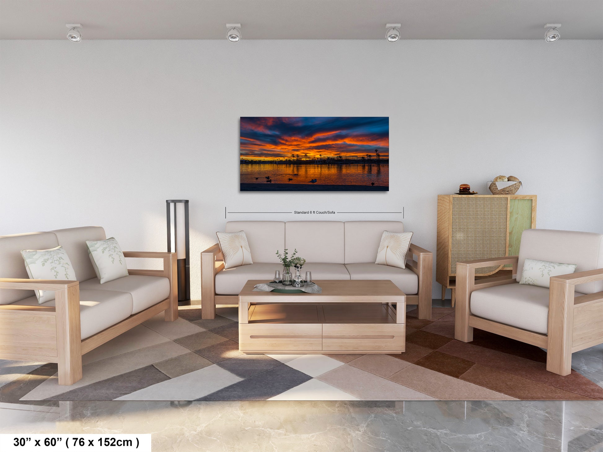 a modern living room with a large, colorful sunset painting hanging on the wall. The room is furnished with a sofa, two chairs, and a coffee table, creating a comfortable and inviting atmosphere.