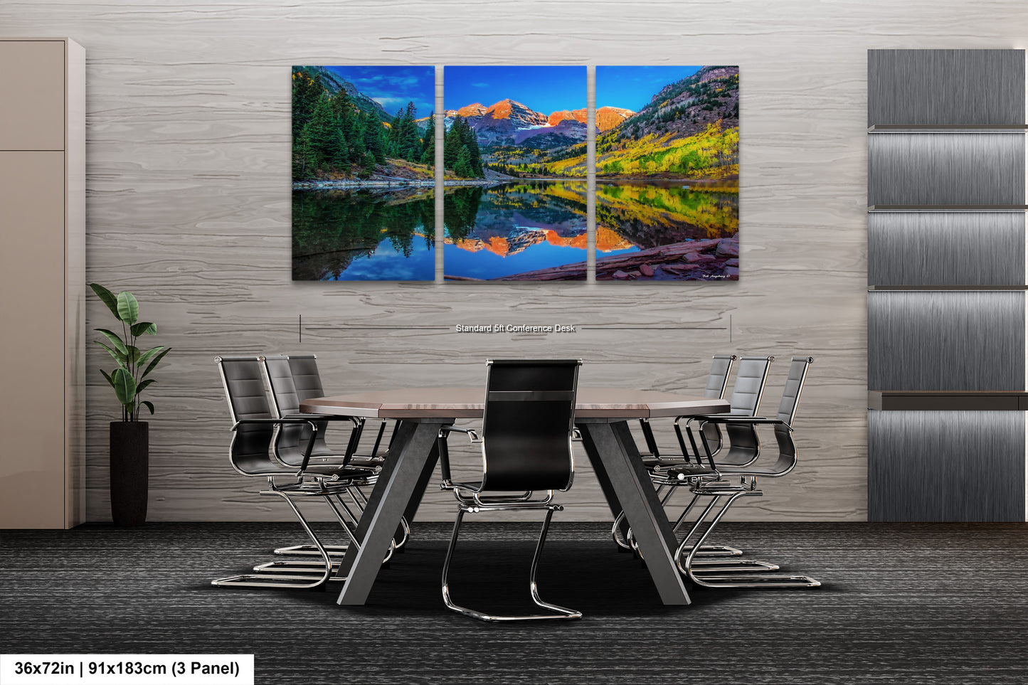 a dining room table with chairs and a painting on the wall