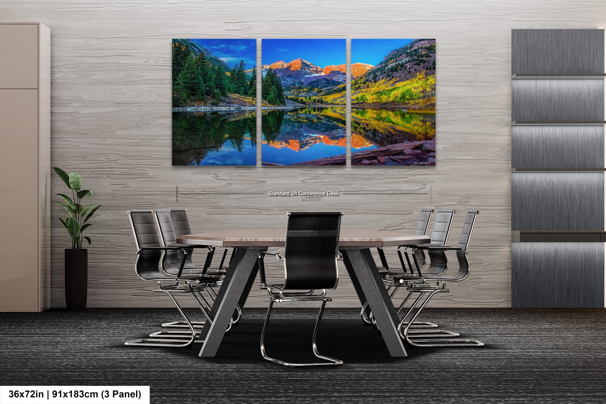 a dining room table with chairs and a painting on the wall