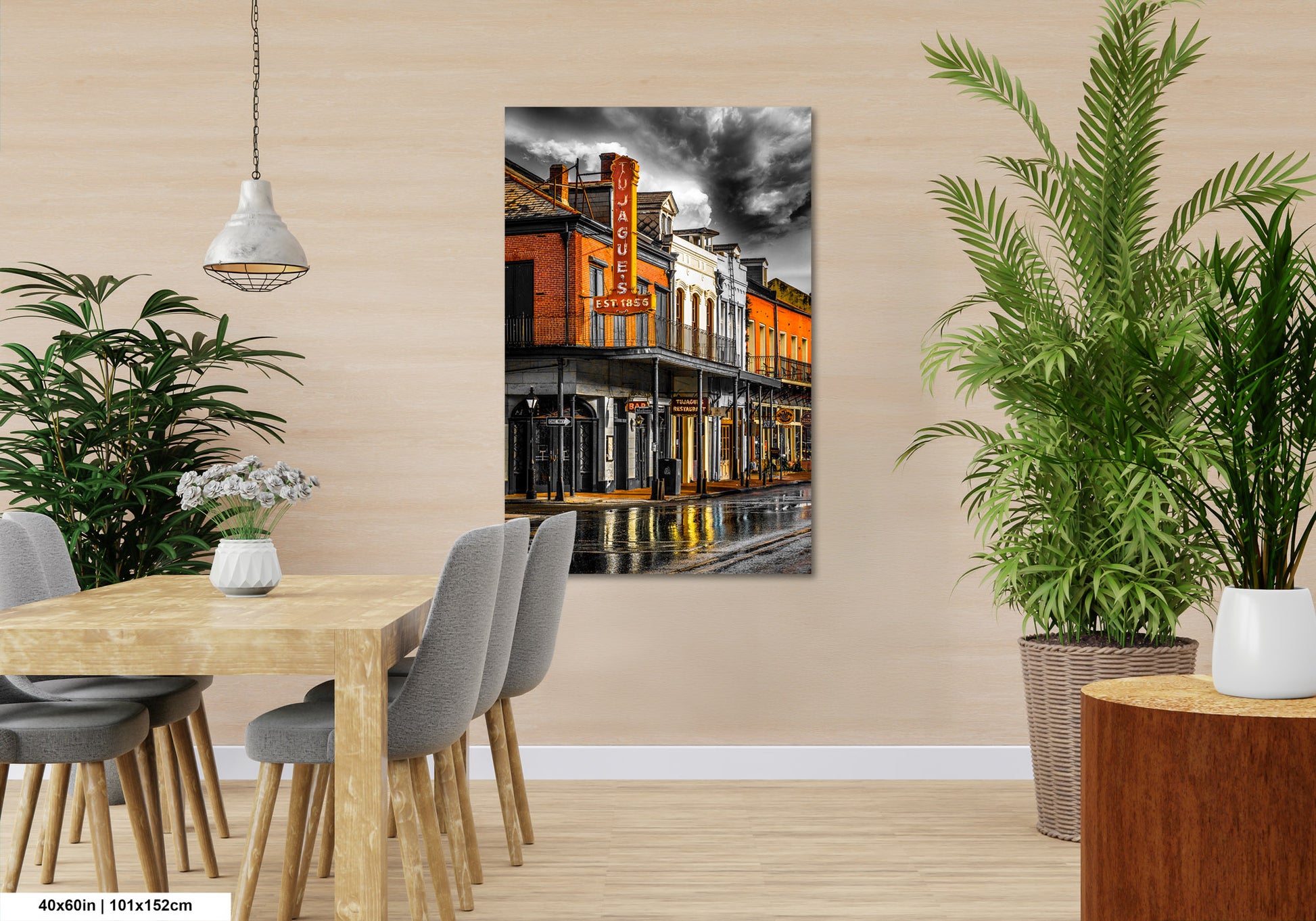a room with a table and chairs and a painting on the wall