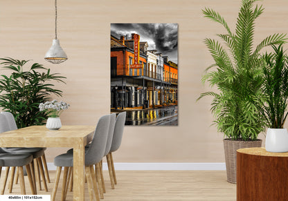 a room with a table and chairs and a painting on the wall