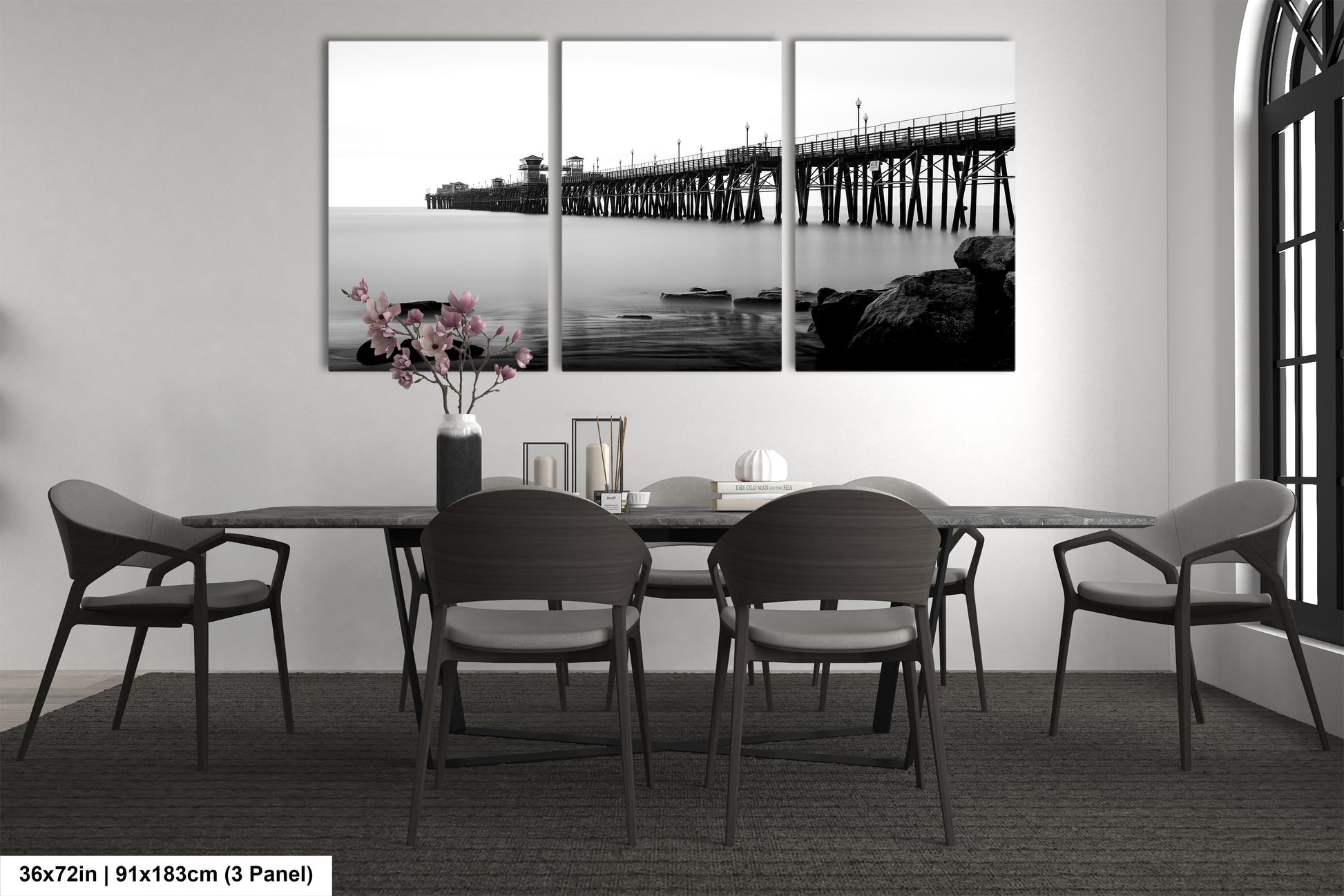 a black and white photo of a dining room table