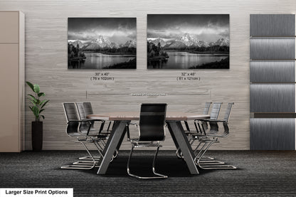 a black and white photo of a table and chairs