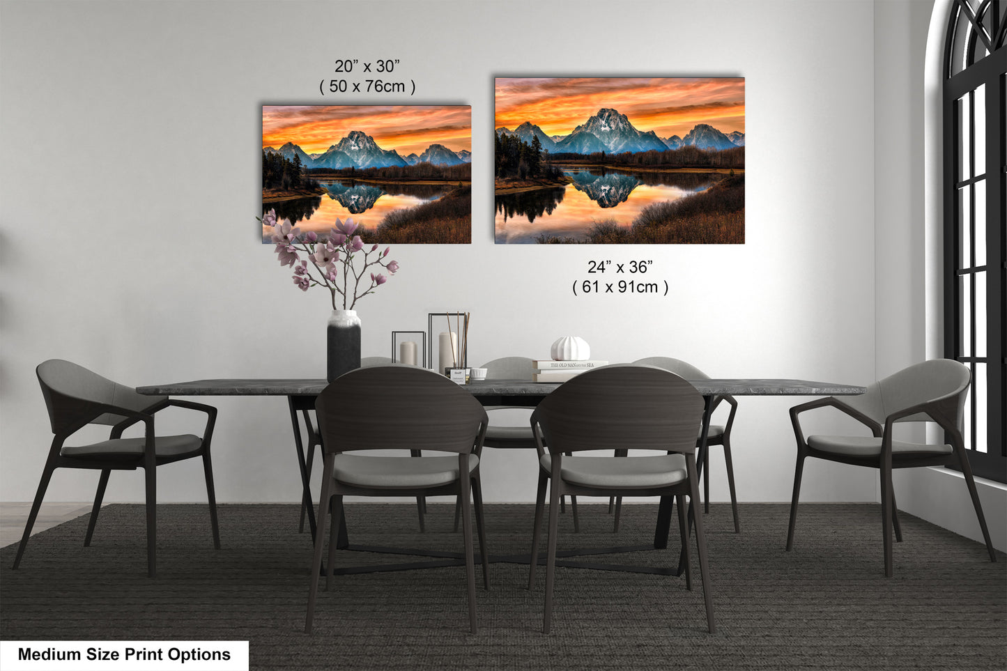 a dining room table with four chairs and a painting on the wall