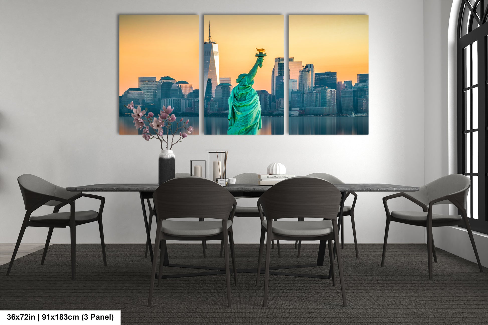 a dining room table with chairs and a picture of the statue of liberty