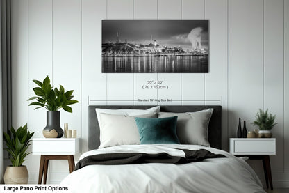 a black and white photo of a bedroom