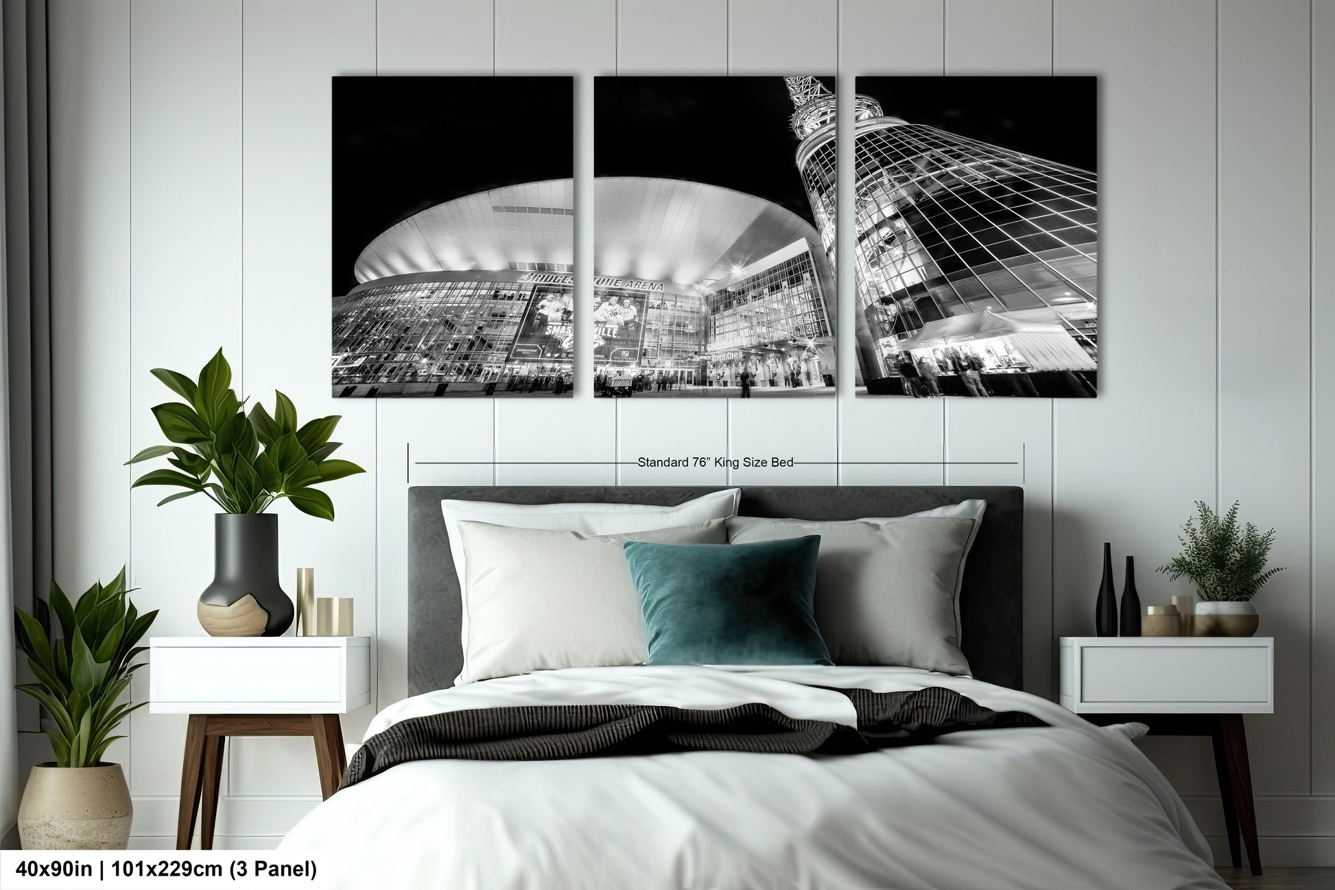 a bedroom with a bed and two paintings on the wall
