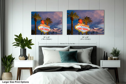 a bed room with a neatly made bed and two pictures on the wall