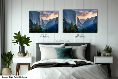 a bedroom with a bed and two pictures on the wall