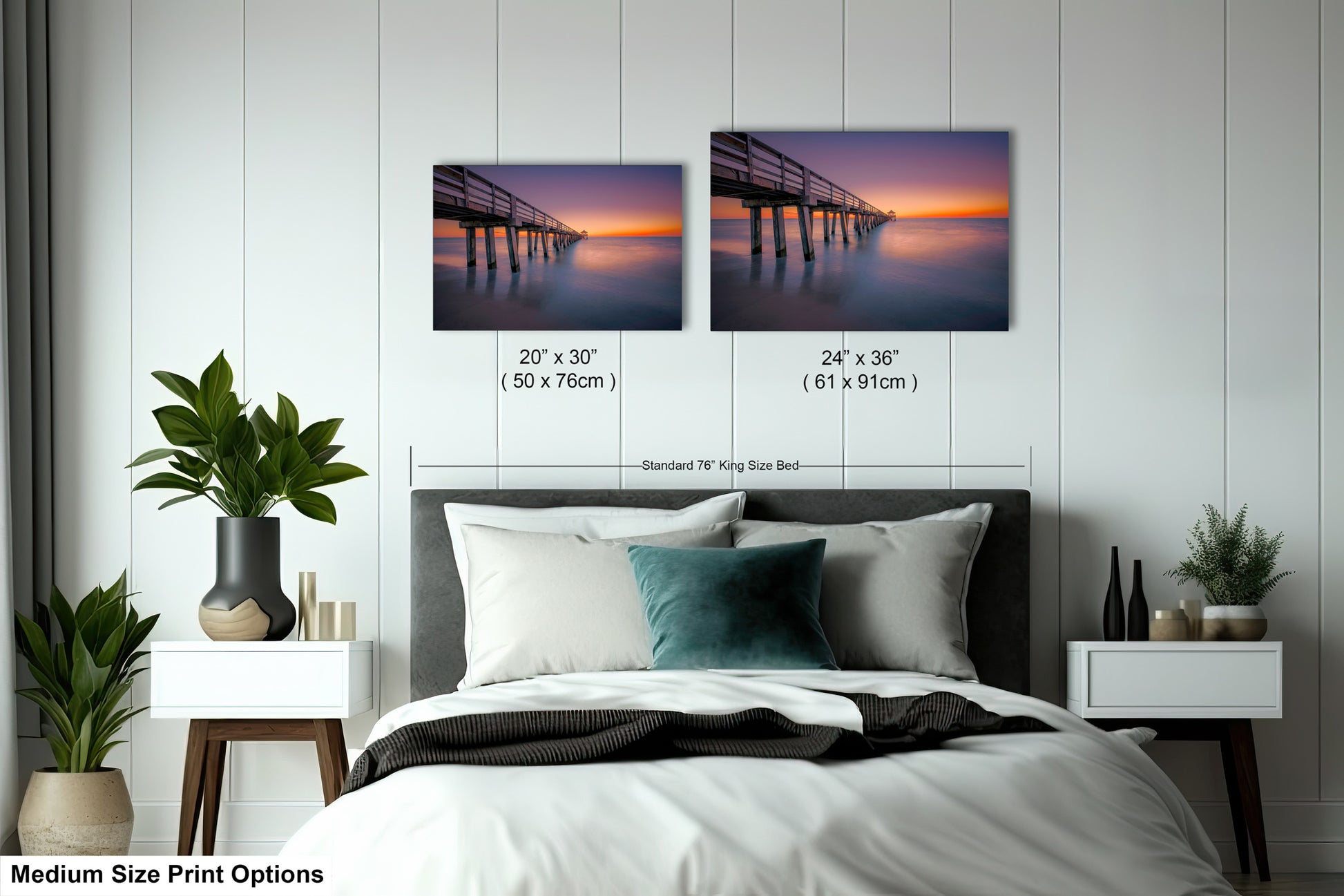 a bedroom with a bed and two pictures on the wall