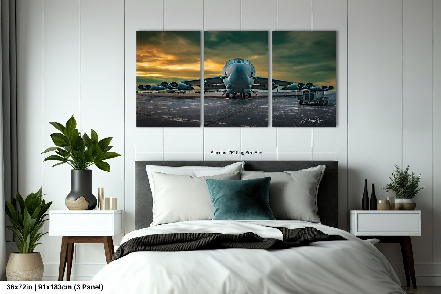 a bedroom with a bed and three paintings on the wall