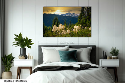 a bedroom with a large bed and a painting on the wall