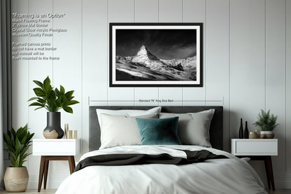 a black and white photo of a bed in a bedroom