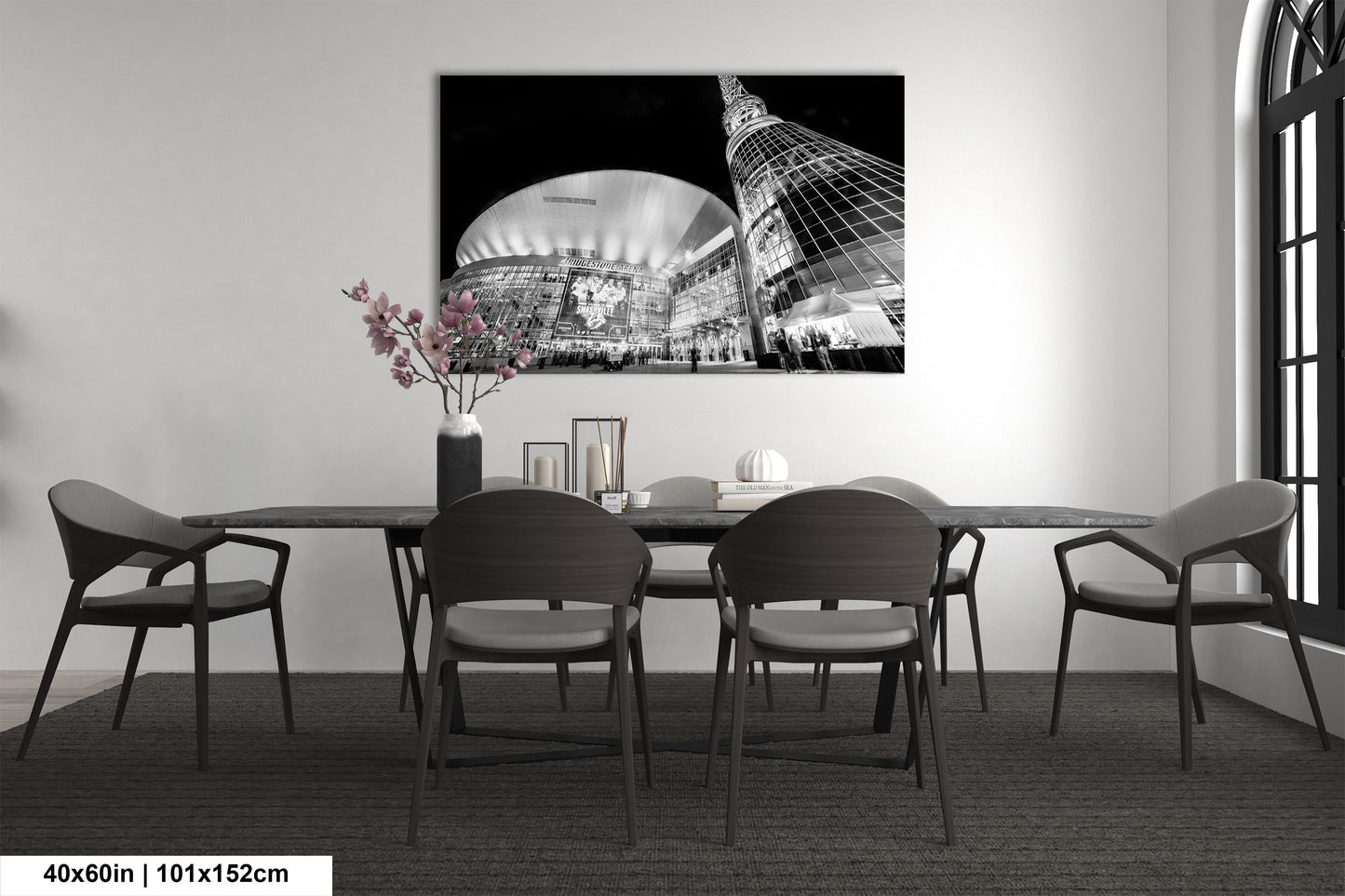 a black and white photo of a dining room