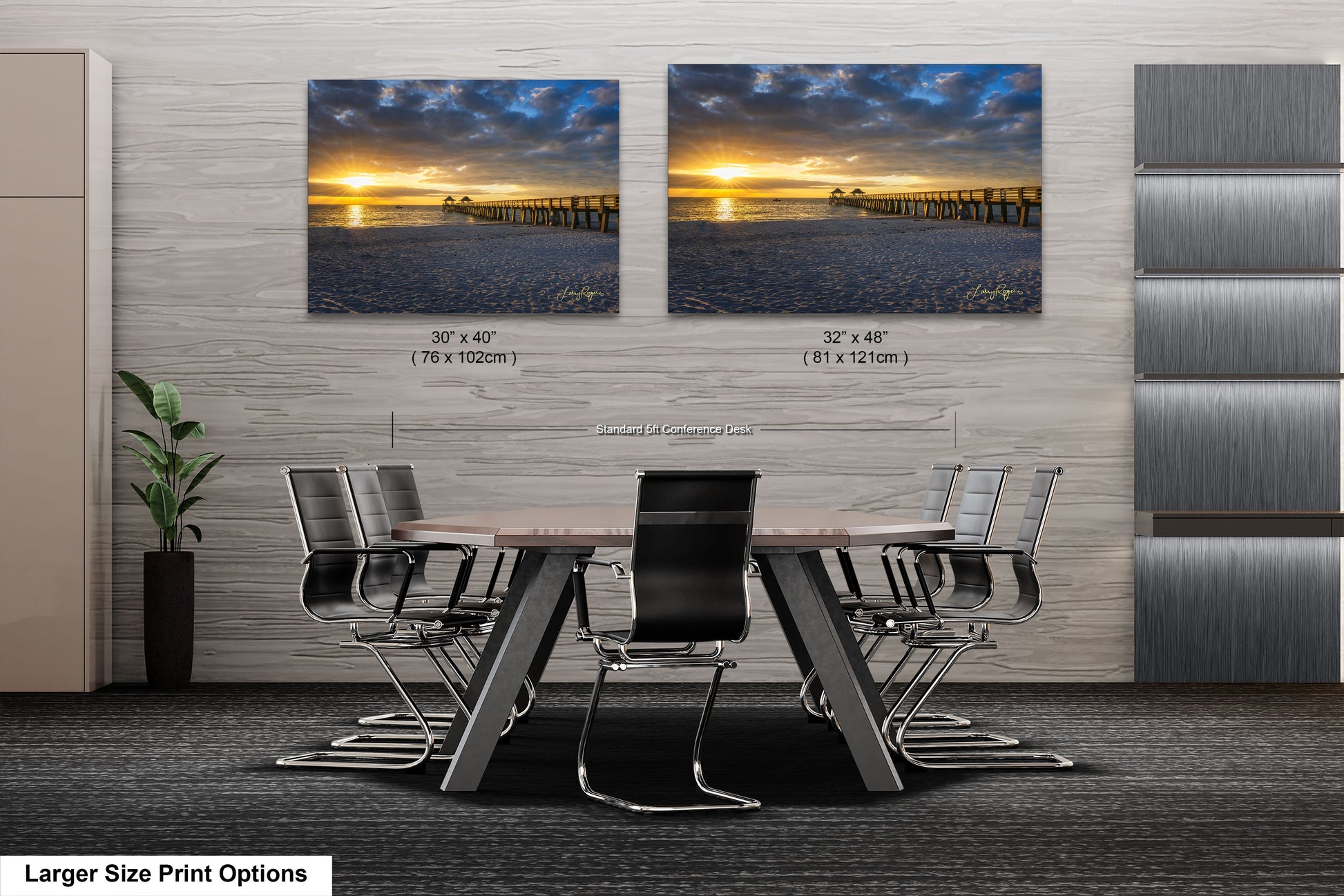 a dining room table with chairs in front of a wall with two pictures of a