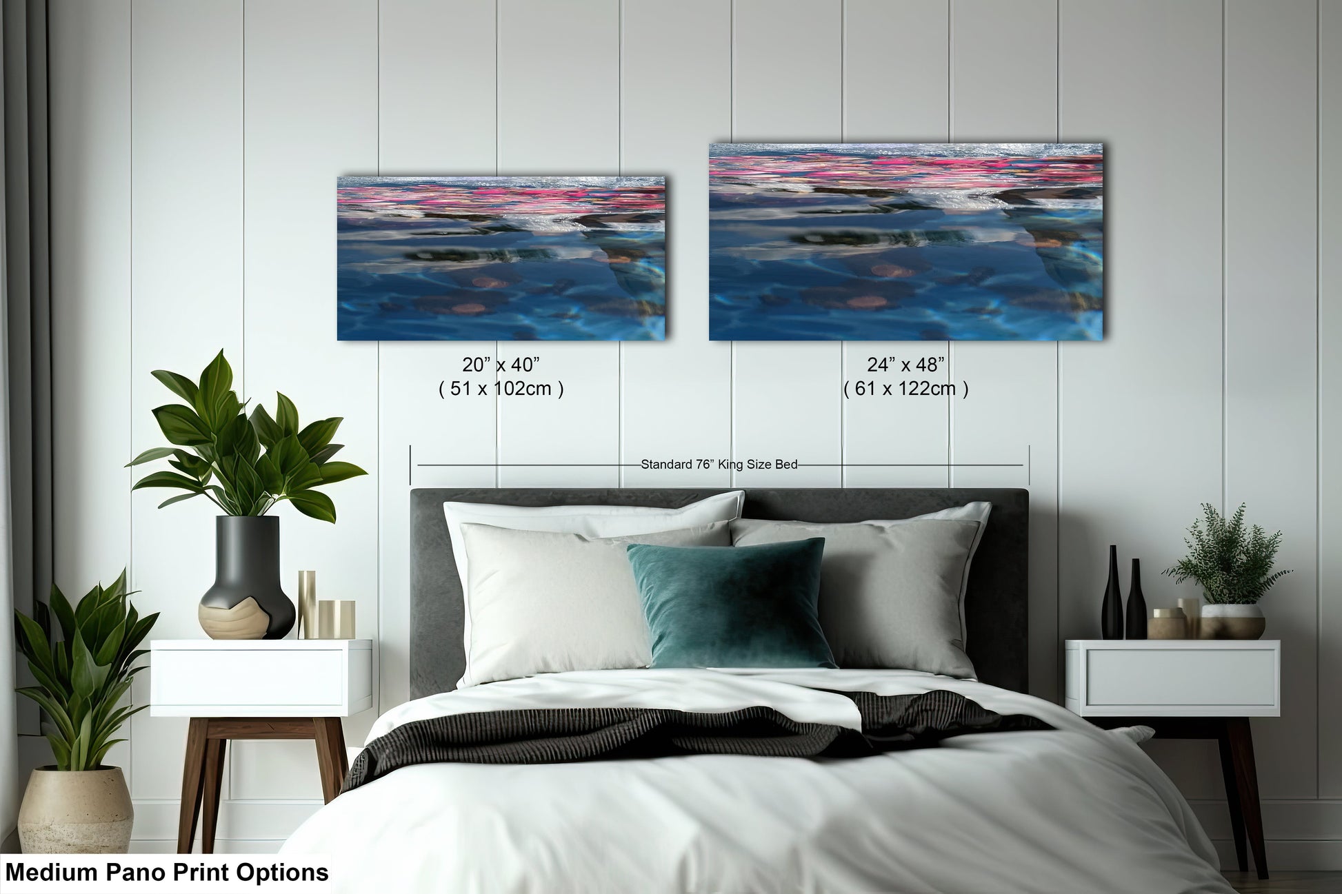 a bed with a white comforter and two paintings on the wall