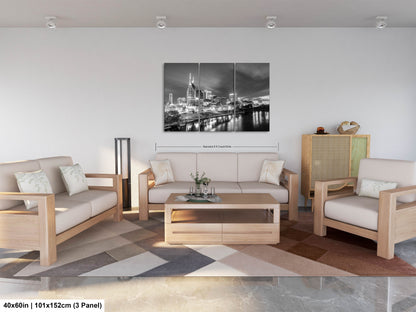 a living room filled with furniture and a painting on the wall