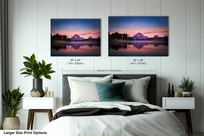 a bedroom with a bed and two pictures on the wall