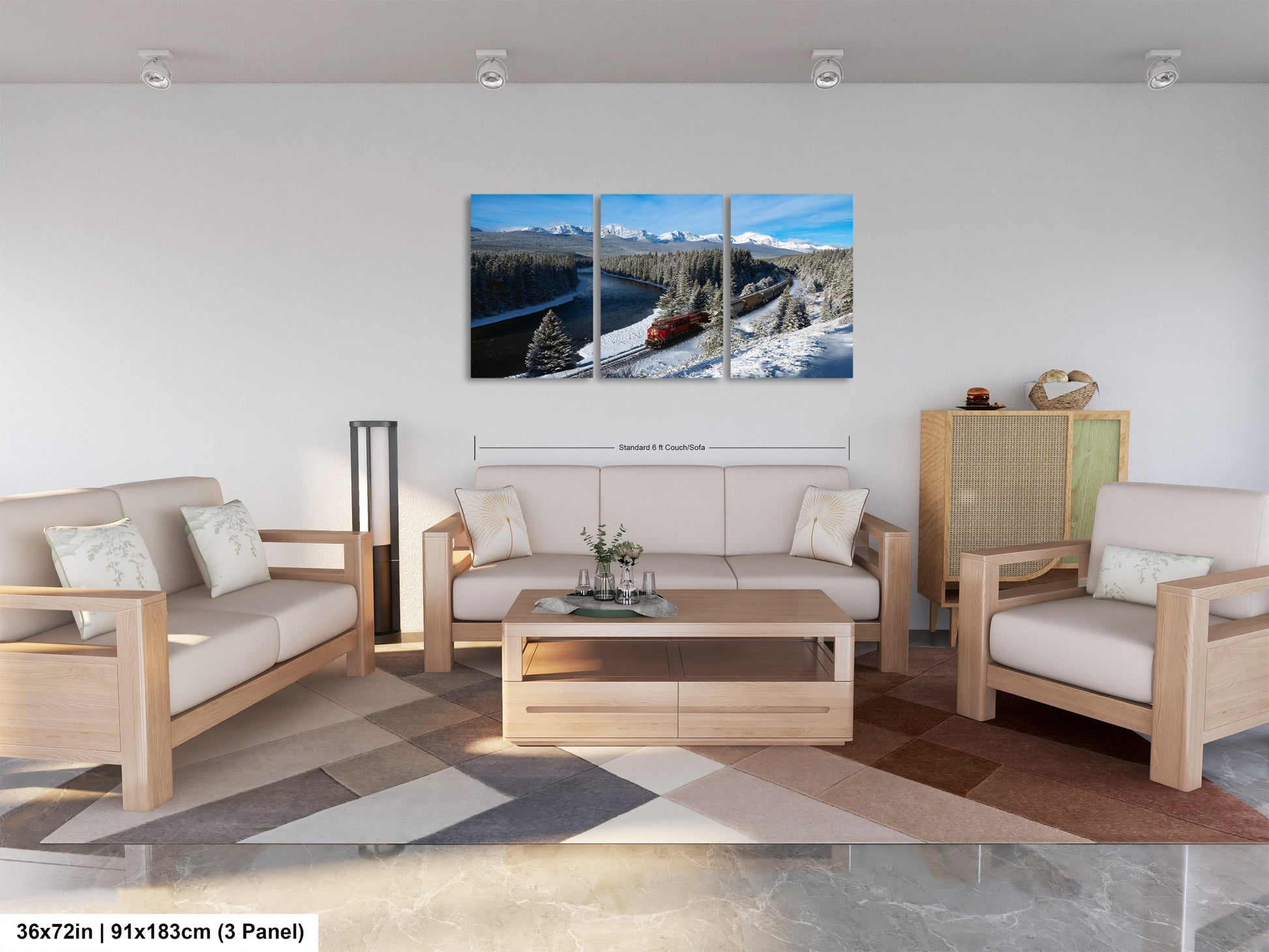 A modern living room with a large, three-panel landscape painting depicting a snowy mountain scene with a train passing through. The painting is hung on the wall above a wooden coffee table and matching chairs.
