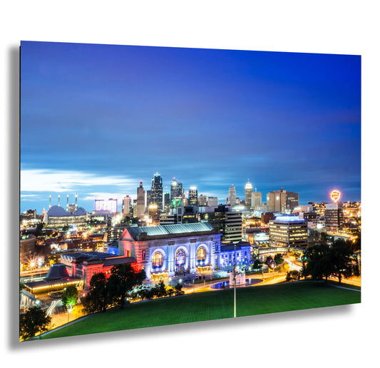 a view of a city at night from a hill