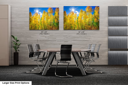 a dining room table with chairs and a painting on the wall