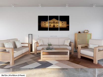 A modern living room with a large, three-panel print of a historic building at night displayed on the wall. The print is framed in a wooden frame and measures 36 inches by 19.83 centimeters, with a total of 9.83 panels. The room is furnished with a sofa, two armchairs, and a coffee table, creating a comfortable and stylish living space.