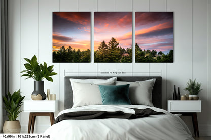 a bedroom with a bed and two paintings on the wall