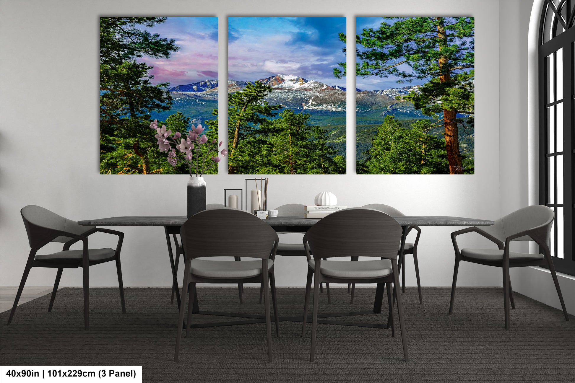 a dining room with a table and four chairs