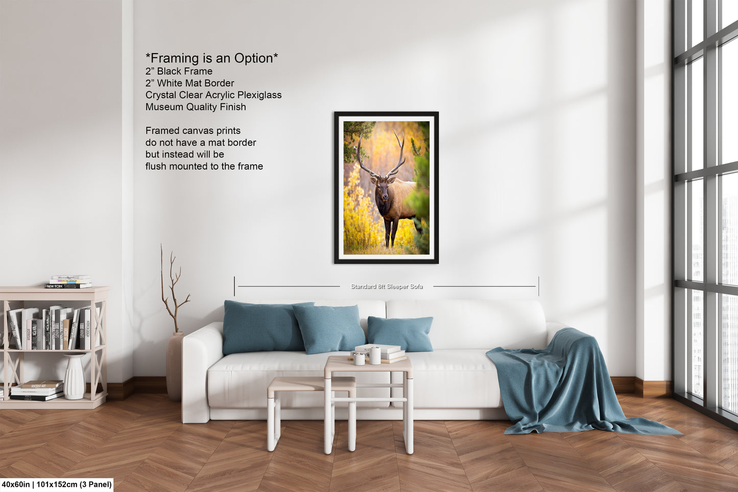 a living room with a white couch and a painting on the wall