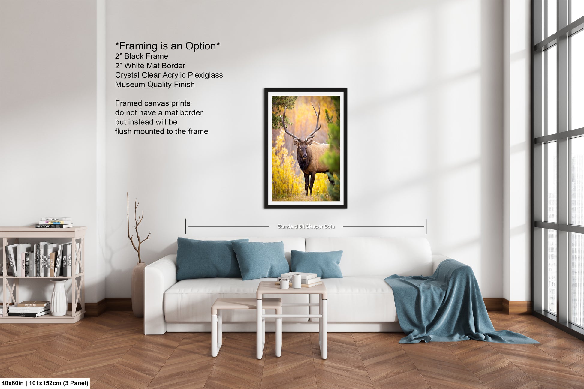 a living room with a white couch and a painting on the wall