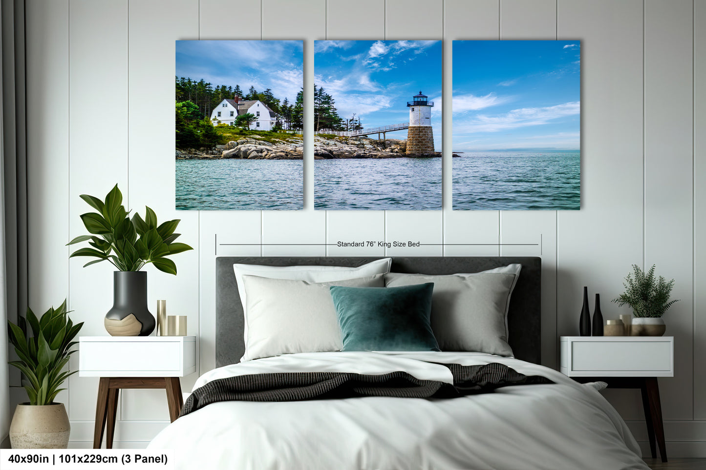 a bedroom with a bed and two paintings on the wall