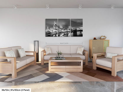 a living room filled with furniture and a painting on the wall