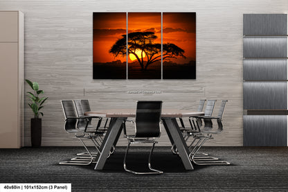 a dining room table with chairs and a painting on the wall