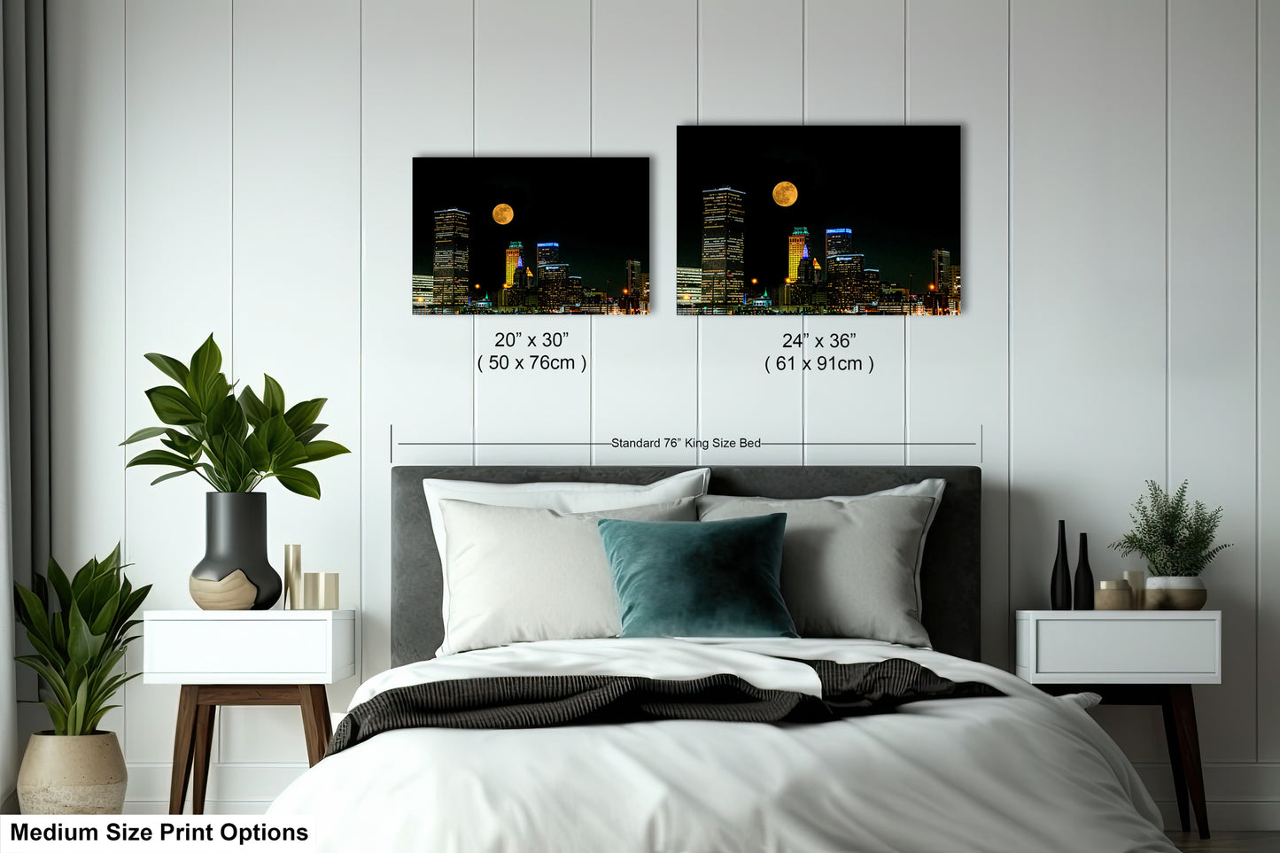 a bedroom with a bed and two pictures on the wall