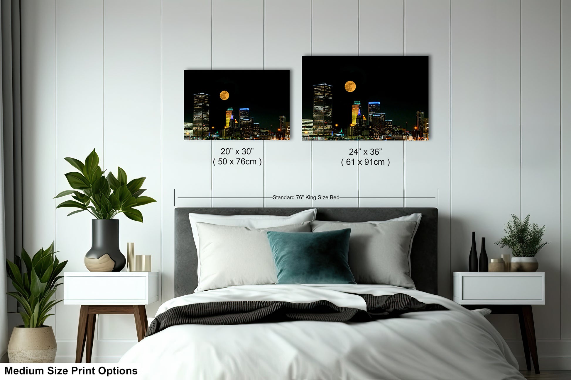 a bedroom with a bed and two pictures on the wall