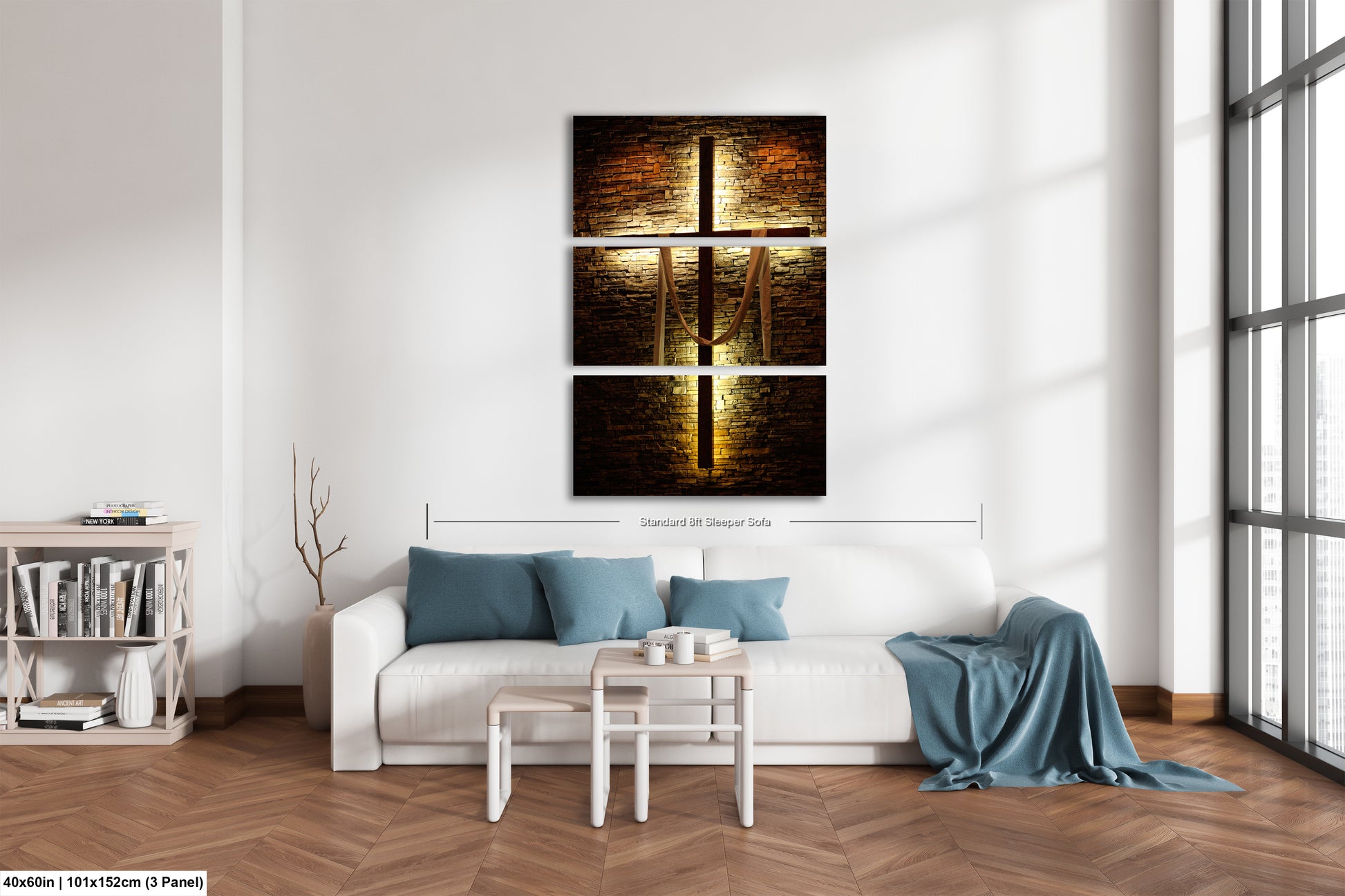 a living room with a white couch and a painting on the wall