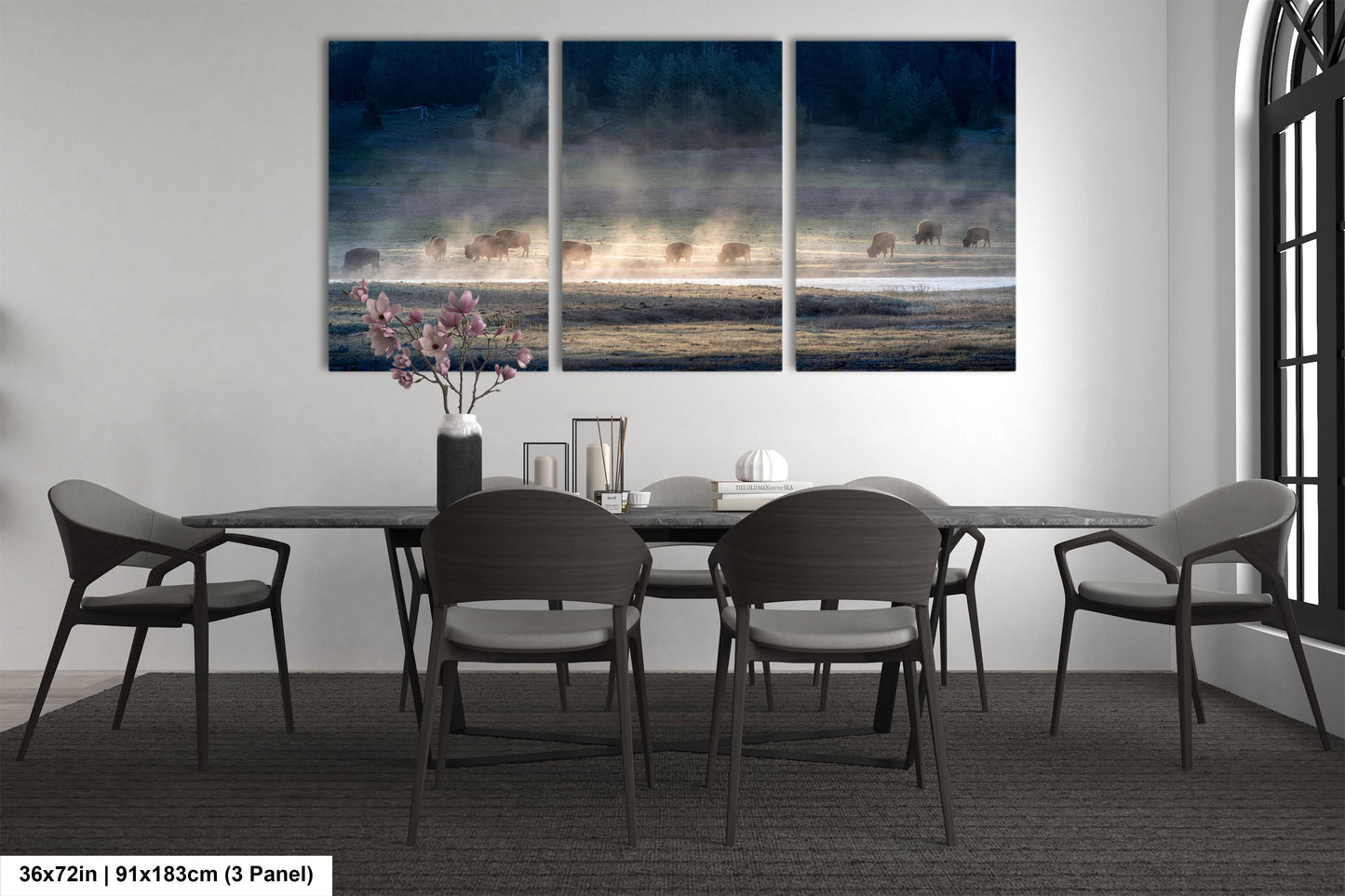 a dining room table with four chairs and a painting on the wall