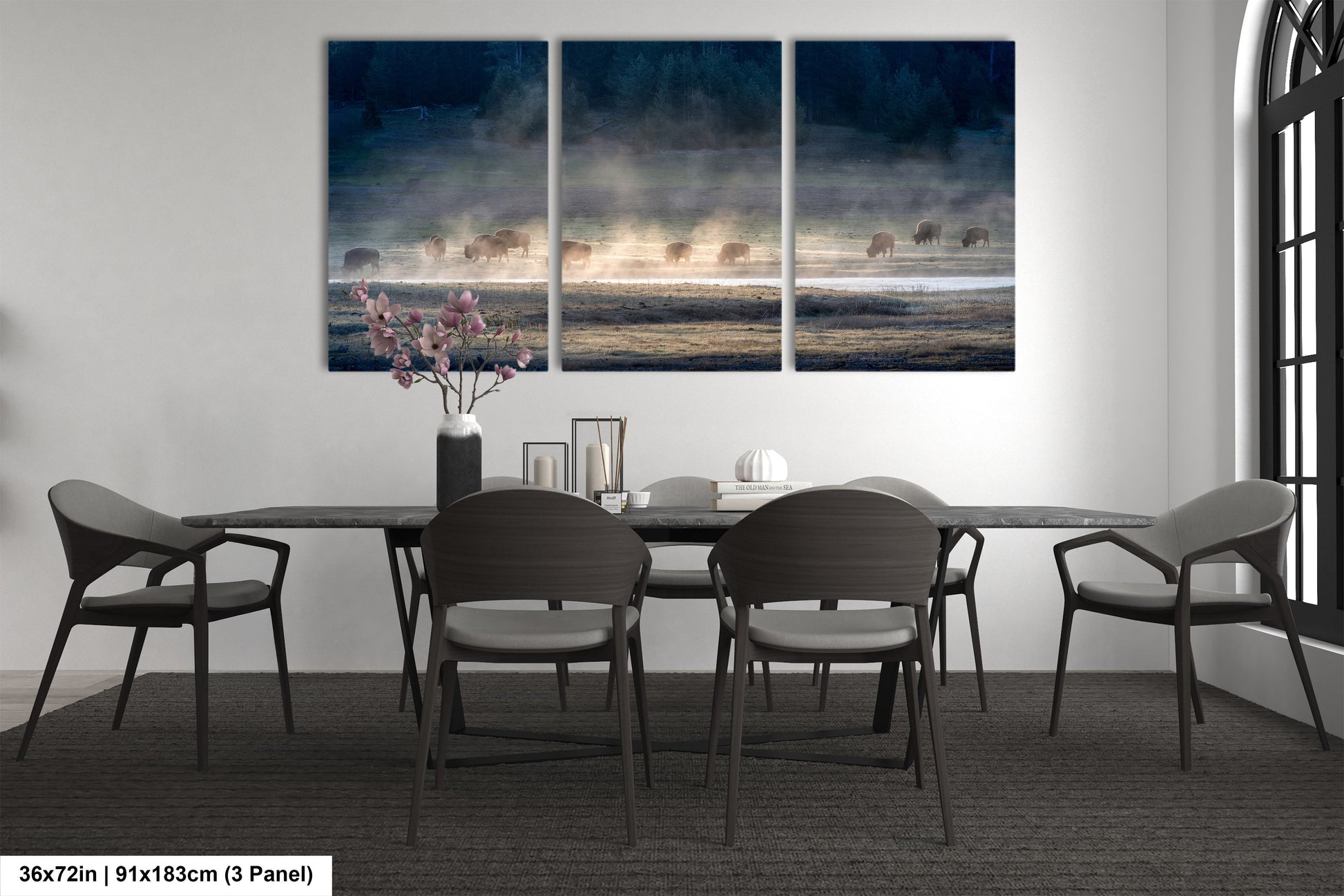 a dining room table with four chairs and a painting on the wall