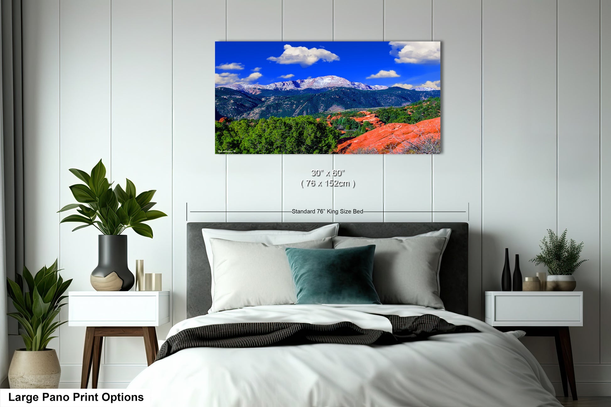 a bedroom with a large bed and a mountain view