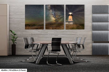 a dining room table with chairs and a table with a light house on it