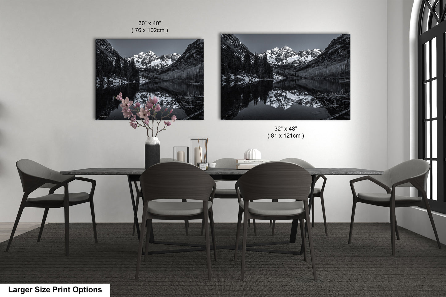 a black and white photo of a dining room table