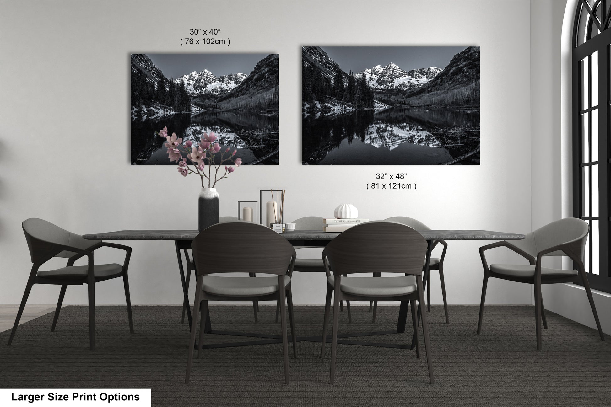 a black and white photo of a dining room table