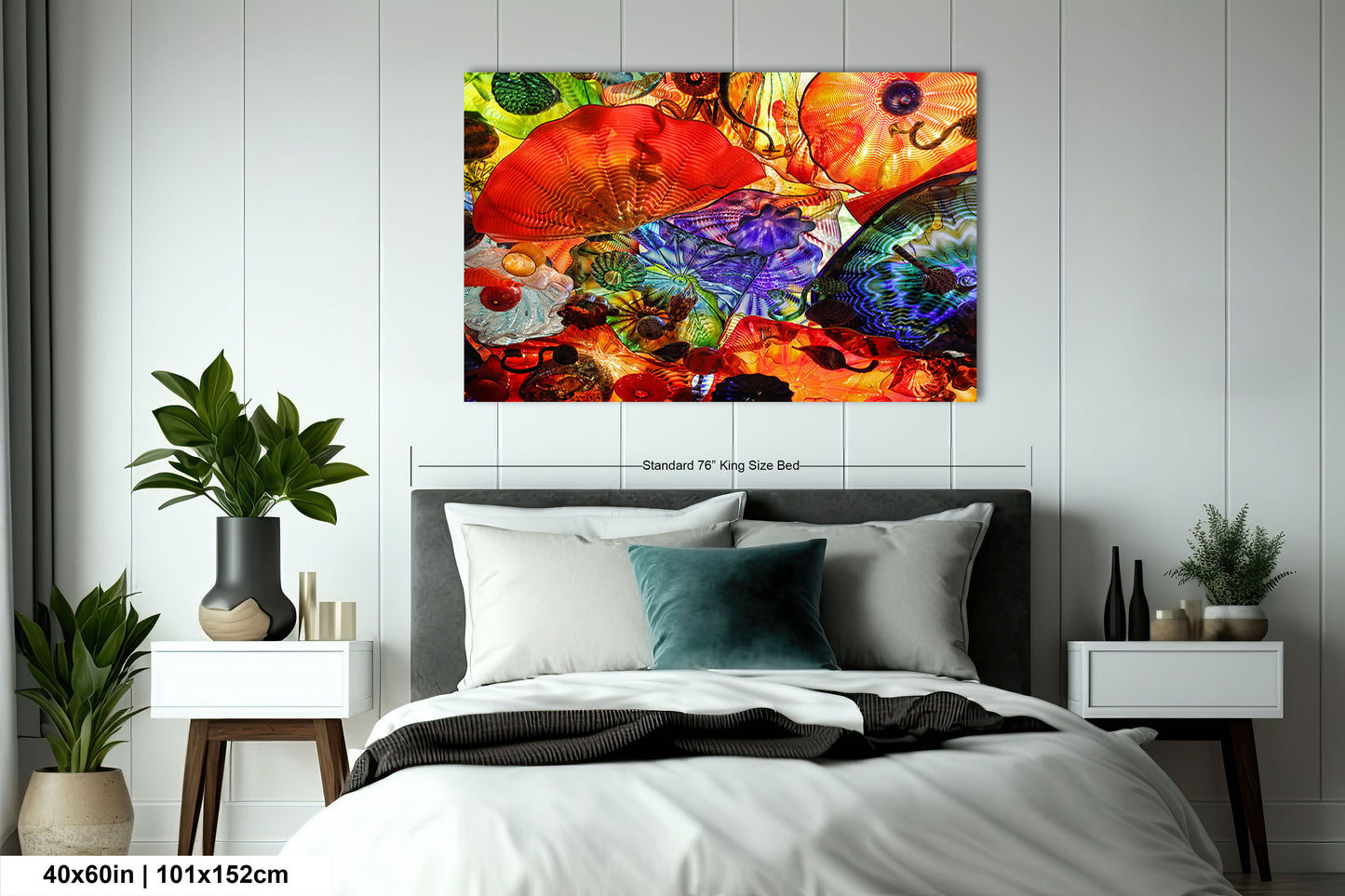 a bedroom with a bed and a painting on the wall