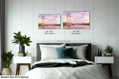 a bedroom with a bed and two pictures on the wall